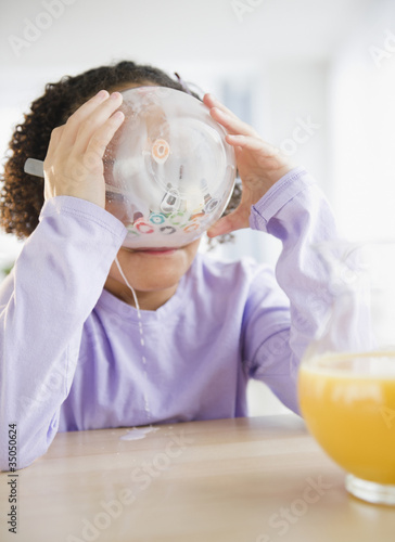 Photo: African American girl eating cereal African American girl eating cereal