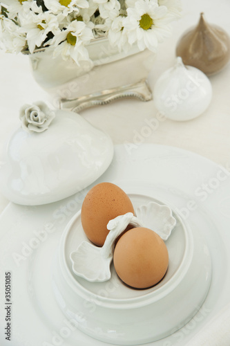 Photo: Two boiled eggs in an ornate egg cup Two boiled eggs in an ornate egg cup