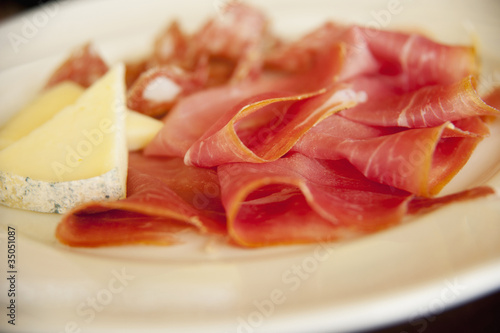 Photo: Close up of cheese and prosciutto Close up of cheese and prosciutto
