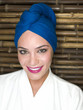 "Glamorous, smiling woman in blue turban"
