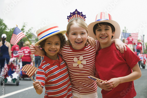 Photo: Friends hugging at fourth of July celebration Friends hugging at fourth of July celebration
