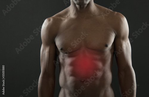 Photo: African American athlete with glowing stomach African American athlete with glowing stomach