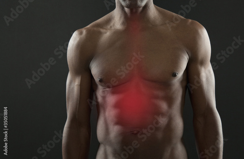 Photo: African American athlete with glowing stomach African American athlete with glowing stomach