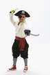 Hispanic boy in pirate costume holding sword
