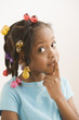 Black girl making shhh gesture