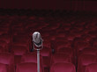 Old-fashioned microphone in empty auditorium
