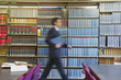 Hispanic businessman doing research in library