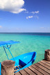 blue boat in wooden tropical pier in Caribbean