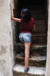 Sexy woman going up on stairs