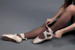 Woman legs in ballet shoes