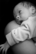 Newborn on mothers shoulder
