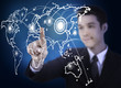 business man pressing a world map touchscreen