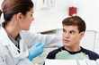 Photo: Dentist having conversation with patient Dentist having conversation with patient