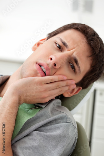 Photo: Young man with a toothache Young man with a toothache