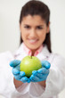 Doctor holding a green apple