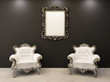Empty frame and two armchairs in luxurious apartment interior