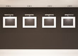 Showroom. Four empty frames on the black wall in modern interior Showroom. Four empty frames on the black wall in modern interior