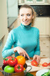 Portrait of woman cooking with vegetables, at home Portrait of woman cooking with vegetables, at home