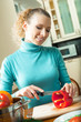 Portrait of woman cooking with vegetables, at home Portrait of woman cooking with vegetables, at home