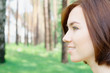 Smiling young girl at the park with copy space