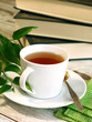 cup of tea and books on wooden cup of tea and books on wooden