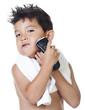 Boy pretends to shave.