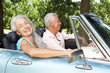 Senior couple in sports car