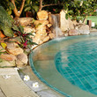 Pool with a waterfall and flowers