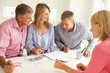 Mid age couples painting with watercolors Mid age couples painting with watercolors