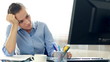 Bored businesswoman sitting at her desk in the office