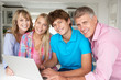 Photo: Family using laptop Family using laptop