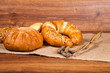 Composition of fresh bread on wood Composition of fresh bread on wood