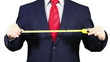 Businessman with measuring tape.