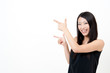 a portrait of attractive asian woman pointing