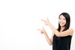 a portrait of attractive asian woman pointing