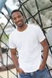Man smiling with hands in his pockets