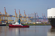 Photo: tug with heavy ship in the harbour tug with heavy ship in the harbour