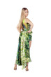 Portrait of a beautiful woman with long hairs in green dress