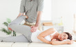 Woman's leg stretched by chiropractor