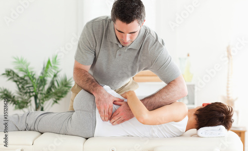 Photo: Masseur massaging woman Masseur massaging woman
