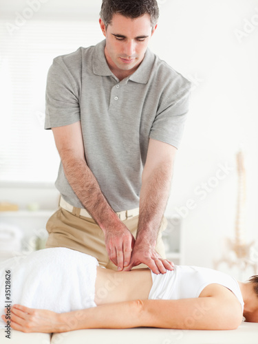 Photo: Gorgeous woman getting a back-massage Gorgeous woman getting a back-massage