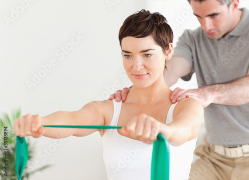 Photo: Patient doing some special exercises under supervision Patient doing some special exercises under supervision