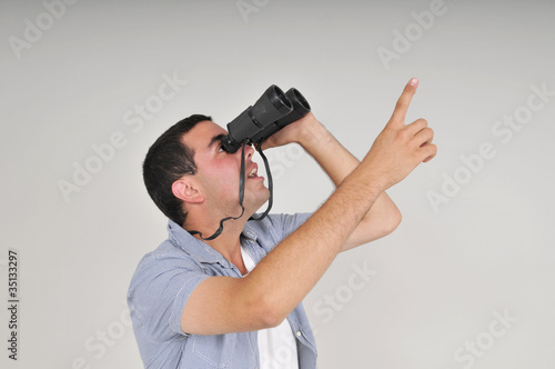 Photo: man with binoculars man with binoculars