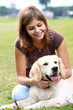 Foto: Young woman with her dog Young woman with her dog