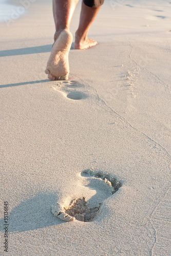 Photo: Footprints on the beach left behind Footprints on the beach left behind
