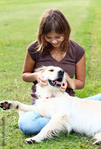 Photo: Young woman with her dog Young woman with her dog