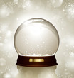 empty snowglobe against a bright defocused background