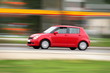 speedy red compact car