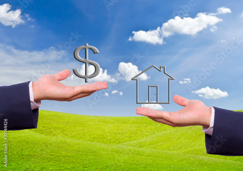 Photo: business man hand exchange dollar sign and house icon business man hand exchange dollar sign and house icon