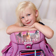 Foto: Cute blond child is happy to start at school Cute blond child is happy to start at school